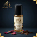 Egyptian Musk body oil with cream-and-gold label in a dark-blue setting