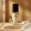 Zicky type body oil with cream-and-gold label in a warm amber setting