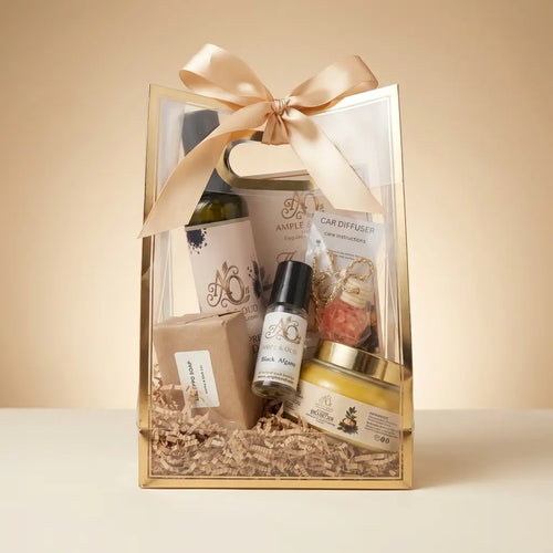 A&O signature five-item gift set on an ivory tabletop with a champagne studio background