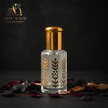 Black Afgano bottle with clean gold cap and Ample & Oud AO logo in a dark setting