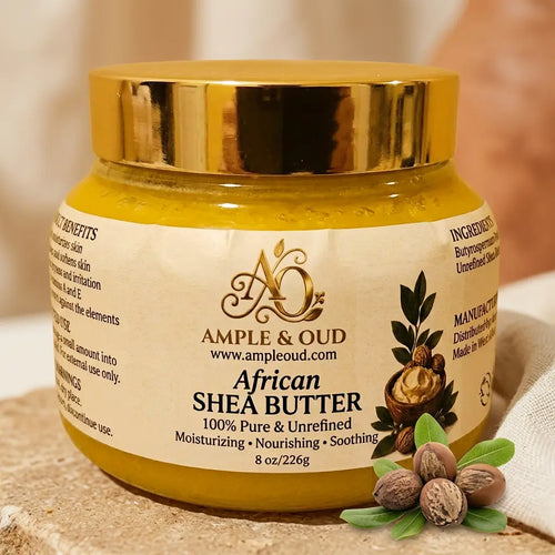 Ample & Oud shea butter jar with gold lid and cream label in an earthy skincare setting